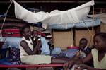 File - A group of Sudanese women rest aboard a boat enroute from Kosti to Juba, Friday, Nov. 19, 2010. They join thousands of southern Sudanese who have left northern Sudan in order to register and vote in southern Sudan's independence referendum scheduled to take place on January 9, 2011.