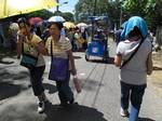 Filipinos walk on the road along Shrine Hills in Matina, Davao City, Philippines for the Via Crucis or Way of the Cross in time for the observance of Good Friday, when Catholics believe that Jesus Christ died on the cross to save the people from sin as seen in this April 9, 2009 file photo.