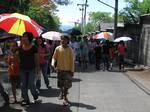 Filipinos walk on the road along Shrine Hills in Matina, Davao City, Philippines for the Via Crucis or Way of the Cross in time for the observance of Good Friday, when Catholics believe that Jesus Christ died on the cross to save the people from sin as seen in this April 9, 2009 file photo.