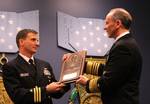 Chief of Naval Operations (CNO) Adm. Jonathan Greenert, right, presents Cmdr. Robert B. Chadwick II with the Vice Admiral James Bond Stockdale Leadership Award.