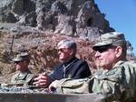 Secretary of the Army John McHugh looks out on Southern Zangabad, Panjwai District, Kandahar Province, Afghanistan, from the observation post at Masum Ghar, while COL Todd R. Wood and CSM Bernard Knight provide an overview of 1st Brigade, 25th Infantry Division operations in Regional Command-South Dec. 14, 2011.