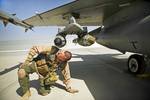 U.S. Air Force Maj. Todd Pierce, a pilot with the 451st Expeditionary Fighter Squadron and native of Norwalk, Iowa, inspects the bombs and missiles on an F-16C Fighting Falcon, April 5, 2012, at Kandahar Airfield, Afghanistan. The mission of the 451st EFS is to deliver decisive airpower on target, on time.