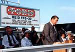 Master of Ceremonies and Vice President of Todd Pacific Shipyards Corporation, Hans K. Schaefer, speaks during christening and launching ceremonies for the guided missile frigate USS Reid (FFG-30) at the Todd Pacific Shipyards Corp., Los Angeles Division, 1981.