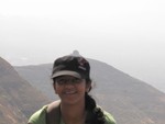 A girl wearing a cap to protect from sun heat in outdoors