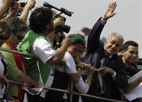 Egyptian presidential candidate Hamdeen Sabahi, gestures to supporters during his campaign ahead of the historic presidential elections in Cairo, Egypt, Sunday, May 20, 2012.