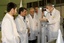 This photo released by the Iranian President's Office, claims to show Iranian President Mahmoud Ahmadinejad, second left being escorted by technicians during a tour of Tehran's research reactor centre in northern Tehran, Iran, Wednesday Feb. 15, 2012. In defiant swipes at its foes, Iran said Wednesday it is dramatically closer to mastering the production of nuclear fuel even as the U.S. weighs tougher pressures and Tehran's suspected shadow war with Israel brings probes far beyond the Middle East.