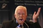 Former US President Jimmy Carter speaks to reporters in Cairo, Egypt