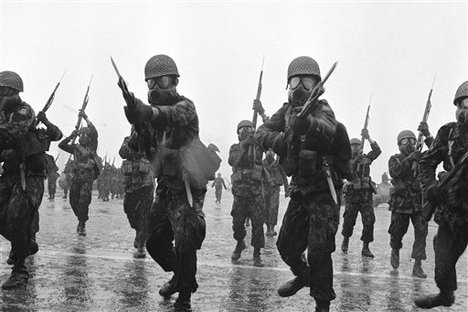 Iranian troops display anti-riot tactics during an exercise at military grounds near the Royal Palace, Jan. 23, 1979 in Tehran.