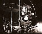 John Bonham, on stage in the US around 1975, whose aggressive drumming style was critical to the hard rock sound associated with the band