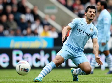 Manchester City's Sergio Aguero, controls the ball during their English Premier League soccer match against Newcastle United at the Sports Direct Arena, Newcastle, England, Sunday, May 6, 2012.