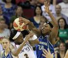 Minnesota Lynx's Charde Houston, right, pressures Seattle Storm's Swin Cash in the first quarter during a WNBA basketball game Tuesday, Aug. 17, 2010, in Seattle. (AP Photo/Elaine Thompson)