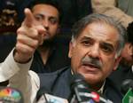 Shahbaz Sharif, the brother of former Pakistani Prime Minister Nawaz Sharif, speaks at a press conference in Lahore, Pakistan, Saturday Dec. 1, 2007. Sharif said the election commission's rejection of his candidacy for the upcoming election was politically motivated. Pakistan's election commission on Saturday rejected his candidacy, saying he had defaulted on a bank loan and was allegedly involved in a murder case in 1998 while chief minister of Punjab province.