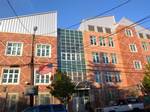 Looking east across 124th Street at PS 161 on a sunny afternoon.