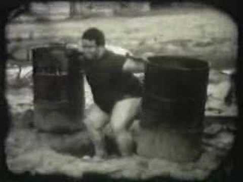 paul anderson squats two 55 gallon concrete barrels