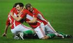 Gergely Rudolf, center, of Hungary celebrates with teammates Pal Lazar, left, and Vladimir Koman after he scored his side's first goal during the Euro 2012 qualifer Group E match between Hungary and Moldova in Szusza Ferenc Stadium in Budapest, Hungary, Tuesday, Sept. 7, 2010