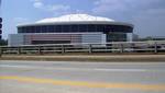 The Georgia Dome is a domed stadium located in Atlanta, Georgia, between downtown to the east and Vine City to the west. It has been the home stadium for the Atlanta Falcons since 1992, and is owned and operated by the State of Georgia as part of the Georgia World Congress Center. The Georgia Dome was the largest domed structure in the world until 1999, when the Millennium Dome in London was completed. The Dome is accessible by rail via MARTA's East-West and Proctor Creek lines, which service th