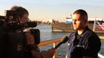 LOS ANGELES (Dec. 3, 2004)--PS2 Carlos Gonzalez, a Sea Marshal, is interviewed by CNN reporter, Chuck Conder, about Port Security concerns and the boarding his team is about to conduct. USCG photo by PA3 Nathan Henise (99057) ( CNN INTERVIEW )