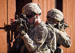 100827-A-3843C-092 Soldiers of the Massachusetts National Guard, 181st Infantry Regiment provide security while clearing room-to-room at the urban warfare range, Camp Atterbury Joint Maneuver Training Center, Ind., on August 27, 2010. Roughly 600 soldiers of the 181st are deploying to Afghanistan as part of the largest deployment the Massachusetts Guard has seen since World War II. DoD photo by John Crosby, U.S. Army. (Released)