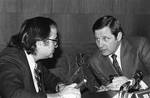 Chairman Birch Bayh, D-Ind., right, confers with Sen. James Abuorezk, D-S.D., at a meeting of a Senate subcommittee examining a proposal for direct enactment of federal laws by voters, in Washington on Tuesday, Dec. 13, 1977. Bayh said he has serious reservations about the wisdom of such a plan. Abourezk is principal sponsor of the measure.