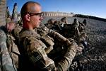 A paratrooper with the 82nd Airborne Division’s 1st Brigade Combat Team waits for helicopters to arrive at Forward Operating Base Arian for an air assault mission May 4, 2012, in southern Ghazni Province, Afghanistan. He is assigned to Company C, 2nd Battalion, 504th Parachute Infantry Regiment. (U.S. Army photo by Sgt. Michael J. MacLeod)