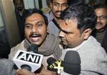 India's former Telecoms Minister Andimuthu Raja, left, talks to the media as he leaves the Central Bureau of Investigation court in New Delhi, India, Friday, Dec. 24, 2010. Indian authorities began questioning the country's former telecommunications minister on Friday as part of investigations into a telecoms scandal that cost the country billions and paralyzed proceedings in parliament for nearly four weeks. The Central Bureau of Investigation, India's equivalent of the FBI interrogated Andimut