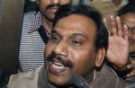 India's former Telecoms Minister Andimuthu Raja, talks to the media as he leaves the Central Bureau of Investigation court in New Delhi, India, Friday, Dec. 24, 2010. Indian authorities began questioning the country's former telecommunications minister on Friday as part of investigations into a telecoms scandal that cost the country billions and paralyzed proceedings in parliament for nearly four weeks. The Central Bureau of Investigation, India's equivalent of the FBI interrogated Andimuthu Raj