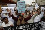 People rally to condemn the death of Pakistan's government minister for religious minorities Shahbaz Bhatti during a rally in Karachi, Pakistan on Wednesday, March 2, 2011. Gunmen shot and killed Bhatti, the latest attack on a high-profile Pakistani figure threatened by Islamist militants for urging reform of harsh blasphemy laws that impose the death penalty for insulting Islam.