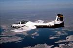 A T-37 Tweet from the 85th Flying Training Squadron, Laughlin Air Force Base, Texas, flies over Amistad Reservoir during a training mission.