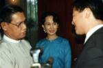 In this photo taken October 10, 1995, Myanmar's pro-democracy leader Aung an Suu Kyi, center, looks on as her deputy Tin Oo, left, greets the then United Nations Human Rights envoy to Myanmar, Yozo Yokota, right, at her house in Yangon, Myanmar. Hollywood star Julia Roberts and detained Chinese activists are among celebrities and political prisoners tweeting and signing petitions for the release of Myanmar's democracy leader Aung San Suu Kyi as she approaches her 64th birthday, her 14th spent in