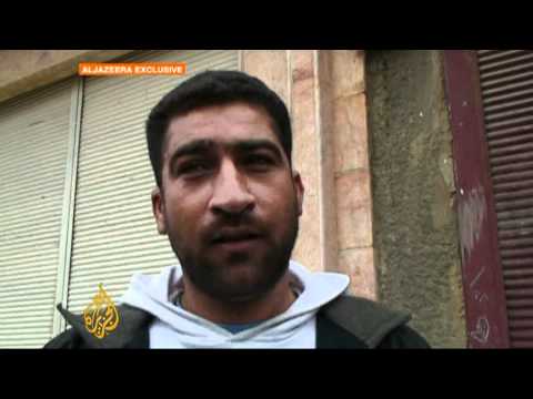 Homs residents in 'war zone'