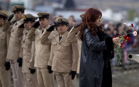 Argentina's President Cristina Fernandez prepares to toss carnations into the Beagle Channel at a ceremony marking the 30th anniversary of the start of the Falkland conflict near the war memorial in Ushuaia, Argentina, Monday April 2, 2012.