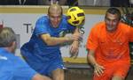 Former football player Zinedine Zidane, centre left, controls the ball with French former cyclist Richard Virenque, during the 