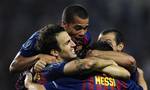 FC Barcelona's Cesc Fabregas, left, reacts with his teammates after scoring against FC Porto during the Super Cup final soccer match at the Louis II stadium in Monaco, Friday, Aug. 26, 2011.