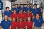 The STS-128 and Expedition 20 crewmembers found a few moments on a day between two spacewalk days to pose for some portraits on the International Space Station. The red-clad crewmembers are with STS-128.