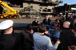 Capt. Thom Burke, commanding officer of the aircraft carrier USS Ronald Reagan (CVN 76) answers questions during an interview with local media.