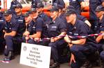 SEATTLE, Wash. (July 3, 2002) --- Smiles abound after the commissioning ceremony of the Coast Guard's first Marine Safety and Security Team in Seattle. MSSTs are domestic mobile units that possess specialized training capabilities to perform a wide spectrum of port safety and security operations. They are modeled after the Coast Guard's Port Security Units (PSUs) and Law Enforcement Detachments (LEDETs). MSSTs are being establised to protect military load-outs; enforce security zones; defend cri