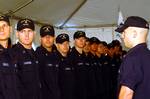 SEATTLE, Wash. (July 3) --- Coast Guard Lt. Kenneth Nagie, Operations Officer of the first Coast Guard Marine Safety and Security Unit commands his troops during the commissioning ceremony. MSSTs are domestic mobile units that possess specialized training capabilities to perform a wide spectrum of port safety and security operations. They are modeled after the Coast Guard's Port Security Units (PSUs) and Law Enforcement Detachments (LEDETs). MSSTs are being establised to protect military load-ou