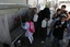 Palestinian students drink water from a public tap in the United Nations Relief and Works Agency (UNRWA) headquarters in Rafah refugee camp in the southern of Gaza Strip on November 02, 2011. The United States cut its funding to the UN's cultural arm after a majority of member states defied American and Israeli warnings and voted to allow jubilant Palestinians full membership in the organisation. PHOTO BY AHMED DEEB/WN