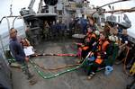 U.S. Navy Divers conduct a dive supervisor brief before dive operations aboard USNS Grasp (T-ARS 51).