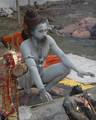 A old Indian Sadhu - Hindu holy man - blesses a pilgrim at a temporary camp in Kolkata, 08 January 2008. Thousands of Hindu pilgrims have started to converge for the Gangasagar Mela which will culminate on 14 January, on the occasion of Makar Sankranti, a holy day of the Hindu calendar, during which a dip in the ocean at the confluence of the River Ganges and the Bay of Bengal, some 150 kms south of Kolkata, is considered to be of great religious significance in Eastern India