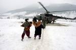 Snow trapped civilians of Nawapachi area of Kishtwar region going for air lift by MI-17 helicopter. IAF�s Jammu based 130 helicopter unit launched massive rescue relief operation in snow covered remotest part of kishtar region of Jammu and Kashmir on January 25, 2012.