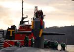 The Los Angeles-class submarine USS Dallas (SSN 700) is tugged to the pier at Naval Submarine Base New London after a scheduled six-month deployment.