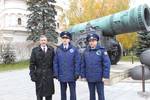 The Soyuz TMA-22 crew members pose for pictures in front of the Tsar Cannon at the Kremlin on 24 October 2011.