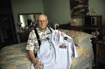 Herb Haeger displays his uniform while sitting on his bed in his home in Rye Brook, N.Y., July 14, 2008. (423322) ( Herb Haeger 3 )