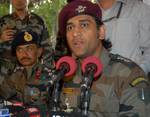 Mahendra Singh Dhoni, Indian cricket team captain and honourary Lieutenant Colonel in the Indian Territorial Army, looks on during a press conference at the Army headquarters in Baramulla, north of Srinagar, on June 3,2012. The cricket boards of India and Pakistan are the ones to decide on the timing and venue for any bilateral cricketing engagements between the two countries, Dhoni said. Dhoni visited the frontier district of Baramulla along the Line of Control in and interacted with soldiers a