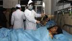 In this photo released by China's Xinhua News Agency, injured miners receive medical treatment at a hospital in Hegang City, northeast China's Heilongjiang Province, on Saturday evening, Nov. 21, 2009.