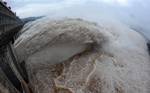 In this photo released by China's Xinhua news agency, flood water is released from the Three Gorges Dam's floodgates in Yichang, in central China's Hubei province, Tuesday, July 20, 2010.