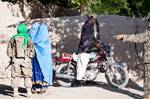 An Afghan women speaks with female engagement team member, 1st Lt. Nalise Gaither, a paratrooper with the 82nd Airborne Division's 1st Brigade Combat Team June 2, 2012, Ghazni Province, Afghanistan. Gaither’s unit, 2nd Battalion, 504th Parachute Infantry Regiment, is conducting a 72-hour operation in this remote mountain village. (U.S. Army photo by Sgt. Michael J. MacLeod)