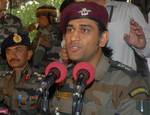 Mahendra Singh Dhoni, Indian cricket team captain and honourary Lieutenant Colonel in the Indian Territorial Army, looks on during a press conference at the Army headquarters in Baramulla, north of Srinagar, on June 3,2012. The cricket boards of India and Pakistan are the ones to decide on the timing and venue for any bilateral cricketing engagements between the two countries, Dhoni said. Dhoni visited the frontier district of Baramulla along the Line of Control in and interacted with soldiers a