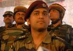 Mahendra Singh Dhoni, Indian cricket team captain and honourary Lieutenant Colonel in the Indian Territorial Army, looks on during a press conference at the Army headquarters in Baramulla, north of Srinagar, on June 3,2012. The cricket boards of India and Pakistan are the ones to decide on the timing and venue for any bilateral cricketing engagements between the two countries, Dhoni said. Dhoni visited the frontier district of Baramulla along the Line of Control in and interacted with soldiers a